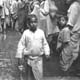 Flower sellers, Benares (Varanasi) photographed by Cecil Beaton (INF 14/434)