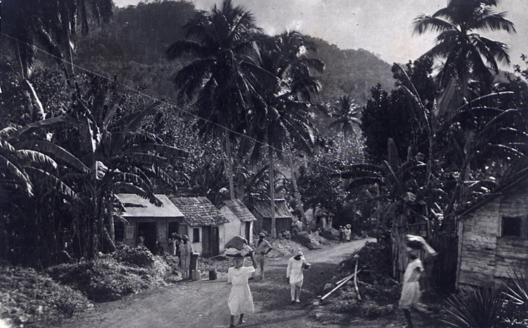 Jamaican village scene with women carrying produce on their heads c1950 (INF 10/153)
