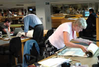 Researchers in map and large document reading room at The National Archives in Kew