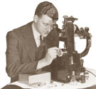 Man using a microscope. Cat ref: COAL 80/1161