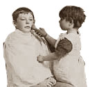 Two boys playing with barbar's tools, 1894. Cat ref: COPY 1/418