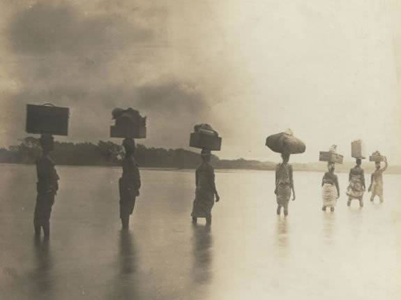 Carriers crossing a river on the seaboard Appolonia (1901) - Catalogue reference: CO 1069/34