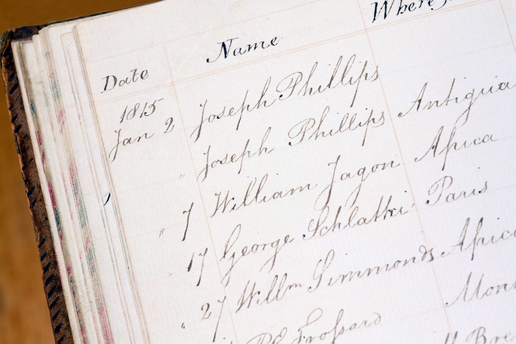 'The Slave Book' with lists of dates, names and locations handwritten in