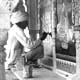 Workman renovating paintings at the city palace, Jaipur, photographed Cecil Beaton (INF 14/443)