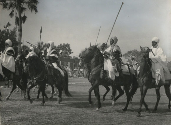 A display of Adamawa Horsemen in honour of Visiting Mission at Yola (1955) - Catalogue reference: CO 1069/24