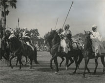 A display of Adamawa Horsemen in honour of Visiting Mission at Yola (1955). - Catalogue reference: CO 1069/24