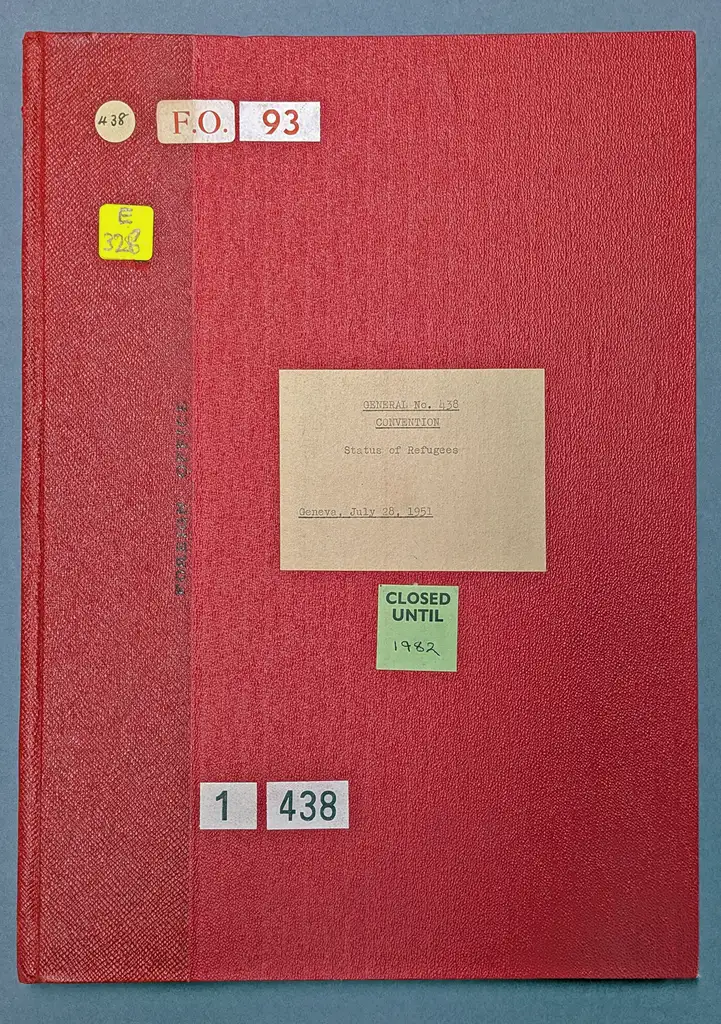 Bright red, leather-bound book cover with a green sticker on it saying 'Closed until 1982'.