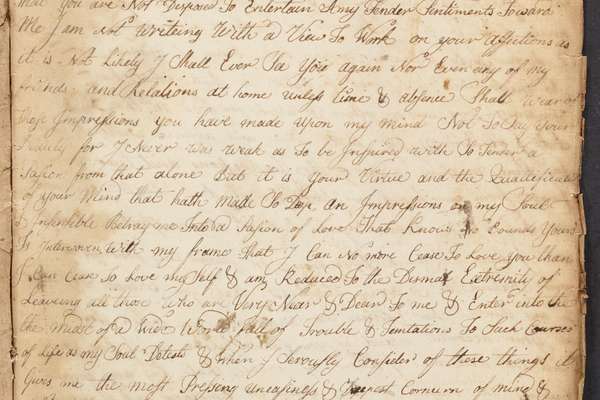 Worn and browned hand written letter, with uneven and torn edges.