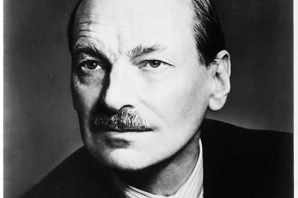 Head and shoulders portrait photograph of Clement Attlee. He is wearing a suit jacket, shirt and tie.
