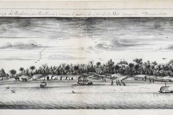 An illustration of a village from the sea with boats in the harbour.