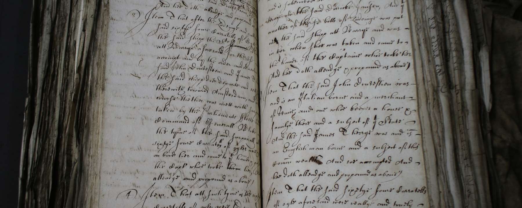 A paper book lying open on a table