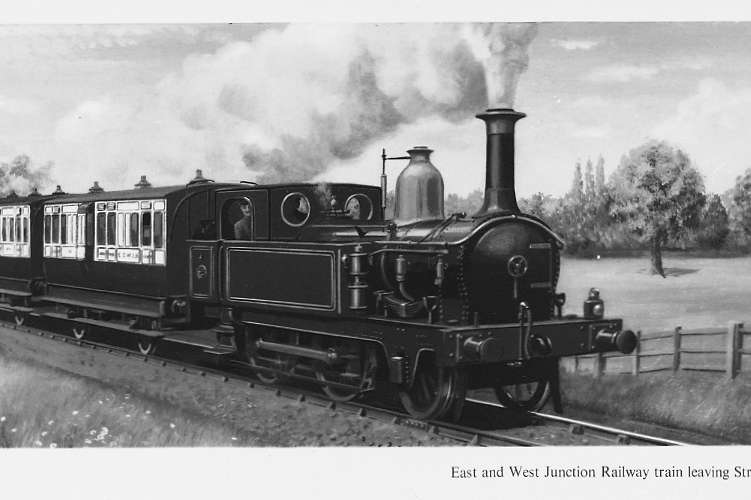 A steam train travelling through the countryside.