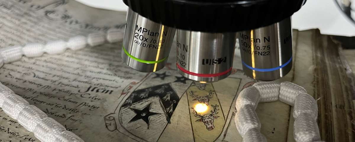 A close up of a scientific instrument above a document.