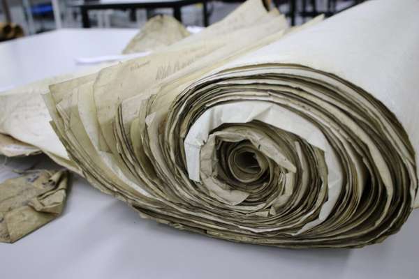 A close up of a large rolled paper bundle