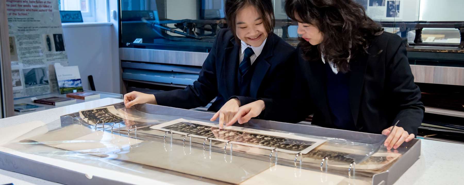 Two students looking at an image in a room