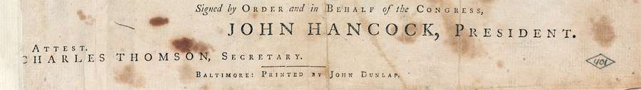 A closeup of an original copy of the US Declaration of Independence where it says it was printed in Baltimore by 'John Dunlap'.