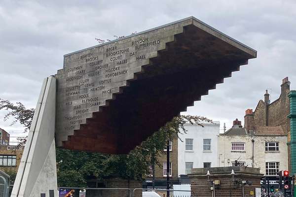 The memorial: an upturned stairway standing in front of the street.