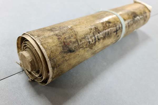 Wound-up roll of old parchment.