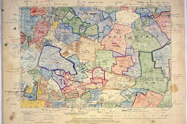 A map of an area which has been divided up into sections and coloured in by hand