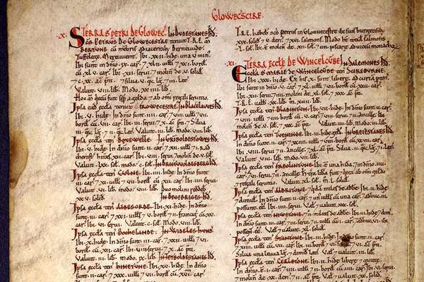 A medieval document with two columns of text in black and red ink