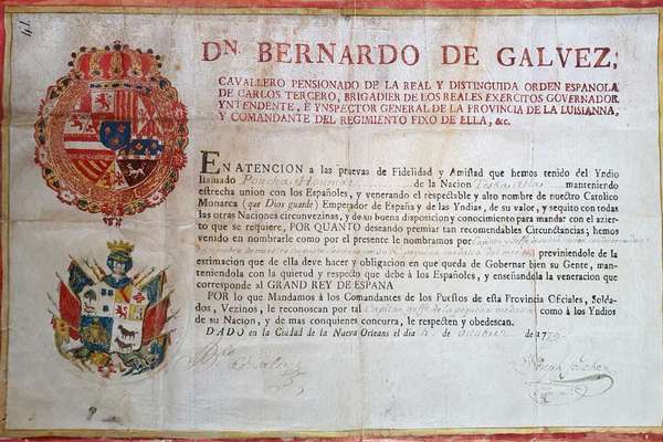 Printed page with a red border and two colourful crests and the heading 'Dn Bernardo de Galvez'.