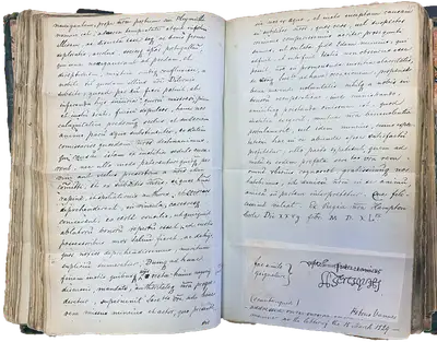 An sizeable notebook opened towards the middle where there is handwritten text.