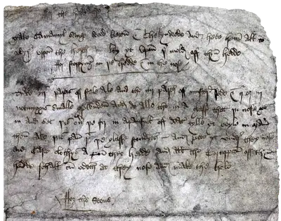 Beautiful Old English writing on a stained and wrinkled leathery surface.