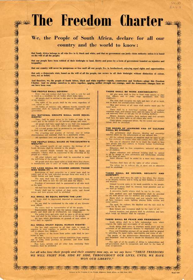 A poster on bright orange paper with a decorative border, filled with printed text setting out the Charter's demands.