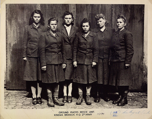 Group photo of six women wearing the same uniform and looking at the camera with serious expressions.