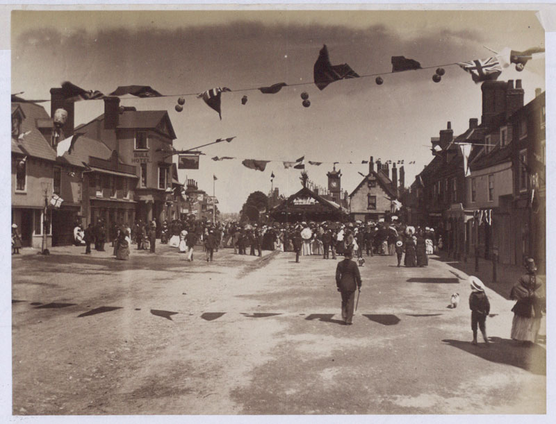 Photograph of High Street Hoddesdon, Hertfordshire, looking north & showing flags across street, Jubilee Day 21 June 1887 (COPY 1/381 f.225)