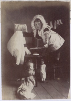 Image of Girl playing with dolls