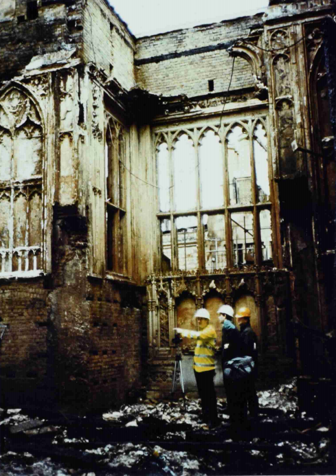 A photograph of workers planning the reconstruction of Windsor Castle after the fire in November 1992 (catalogue reference: PREM 19/4170)