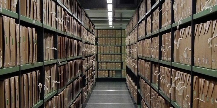 Rows of shelves holding brown archival boxes