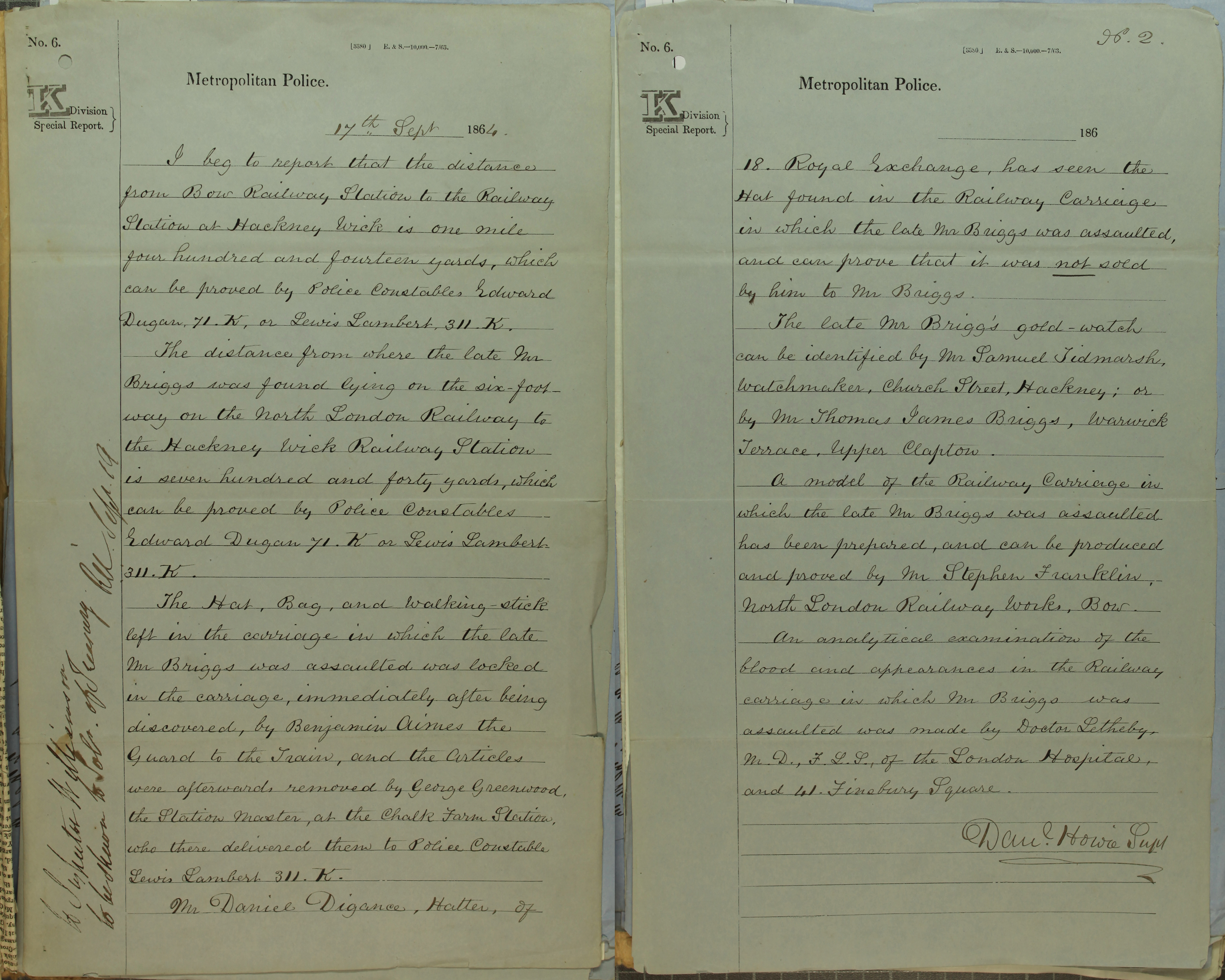 Open book with handwritten report.