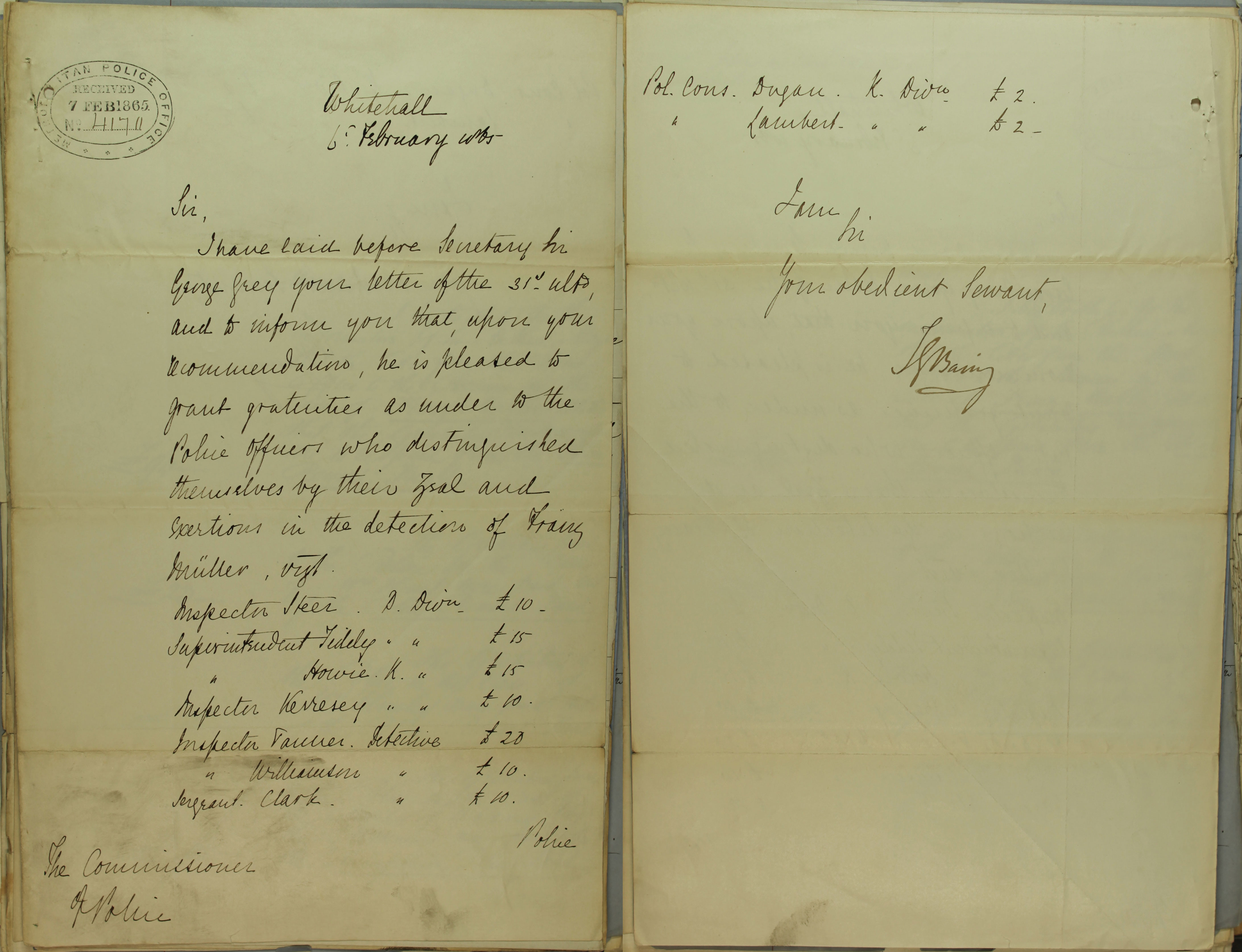 Open book showing a handwritten letter.