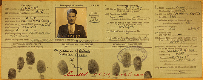 An identity card for a seaman called Bag Kushia that records various information about him including birthplace, distinguishing features, union, and next of kin, as well as his fingerprints.