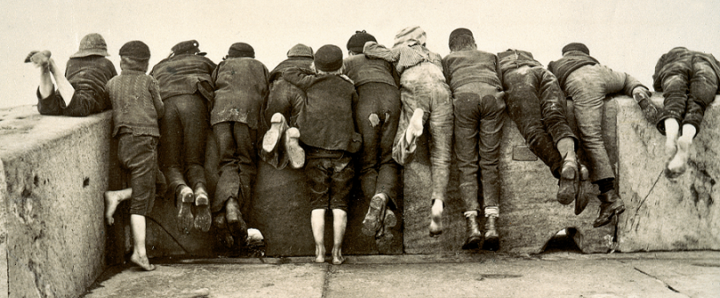 This photograph of twelve boys leaning over a wall, seen from behind, entitled 'Stern Reality' by Frank Meadow Sutcliffe, is among the tens of thousands of photographs registered for copyright and now held at The National Archives. The photograph was registered in 1892 (catalogue reference COPY 1/408/127.