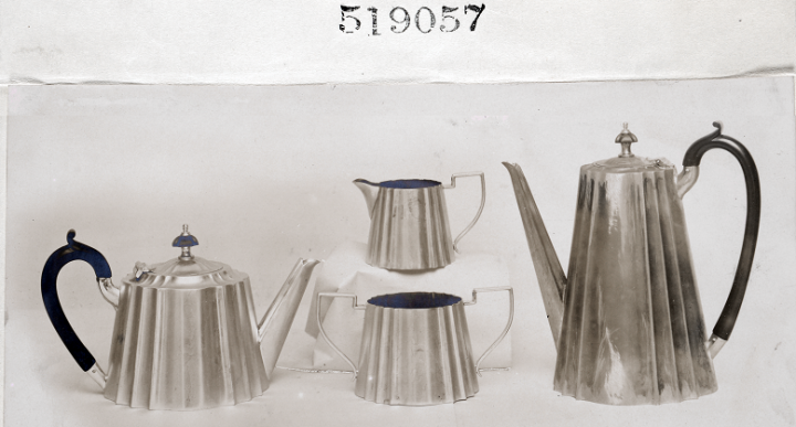 A silver-coloured metallic tea set consisting of a sugar bowl, a jug and two kettles, whose design was registered in 1908 (catalogue reference BT 52/1, registered design number 519057). Representations for non-textile designs came increasingly in the form of photographs.