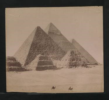 The pyramids at Giza in Egypt, 1890s, with two tiny images of camels in the foreground (catalogue reference CO 1069/179).