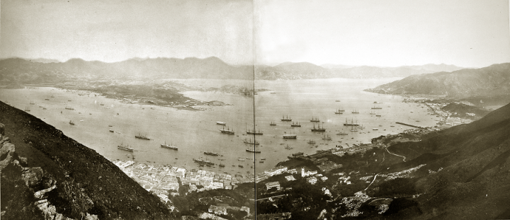 Hilly landscape surrounding a bay in which many boats are anchored. One of several panoramic shots of Hong Kong in the 1890s held in CO 1069 (catalogue reference CO 1069/447).