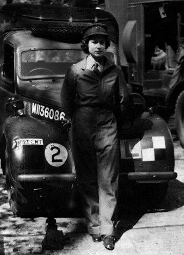 HRH Princess Elizabeth, later Queen Elizabeth II, in her Auxiliary Territorial Service uniform, stood in front of a military car, in 1945 (catalogue reference INF 2/44/612).