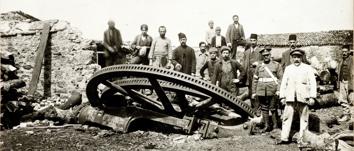 A picture of a group of men (a cropped version of the original), some in military uniform, others in civilian clothing, gathered around a destroyed 28cm gun, is among an album of 170 photographs taken during the Gallipoli Campaign (catalogue reference WO 317/1/30).
