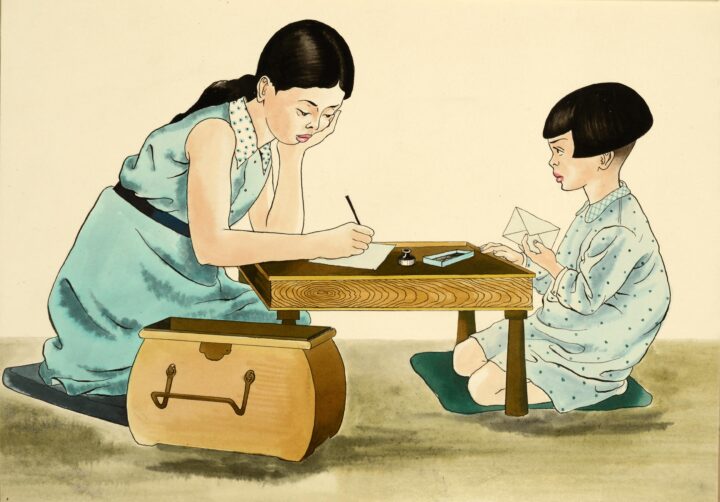 Photograph of schoolgirl and younger sister kneel at low table, the elder girl writing while her young sister waits with an envelope. Both girls look thoughtful.