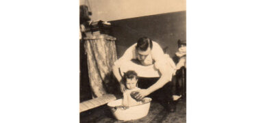 Image of William Jackson bathing his daughter Irene