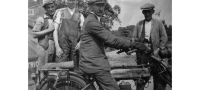Image of Mr Holland (on bike), others unknown