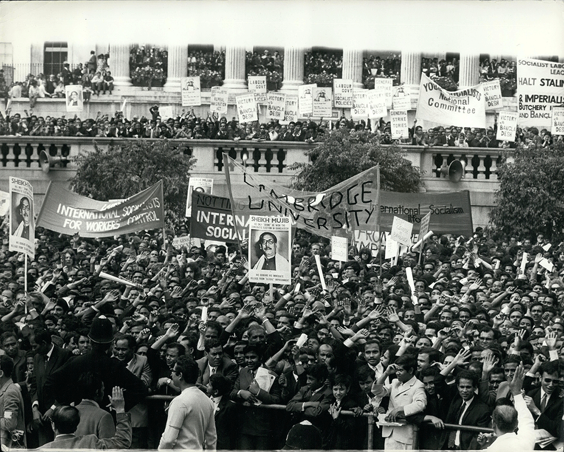 Rally for Independence: Large crowd demonstrates with banners supporting Sheikh Mujibur Rahman and Bangladesh's independence in 1971.
