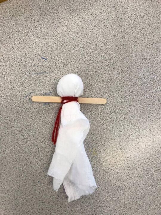 Bibi doll with head made from cotton wool ball and thread tied around the bottom