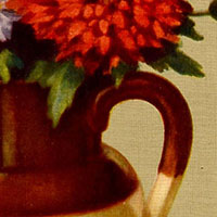 Cropped image. We can see a brown and cream object with a curved handle below a round red flower and green leaves. 