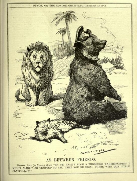Cartoon shows a large bear wearing a cap sitting down on the back legs and tail of cat lying on the ground. The cat is labelled ‘Persia’. A seated lion is shown looking at both animals. There are two palm trees in the distance. 