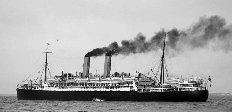 Monochrome photograph of a large steamship moving through the water.